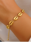 Bracelet en acier inoxydable doré – Coquillages cauris stylisés